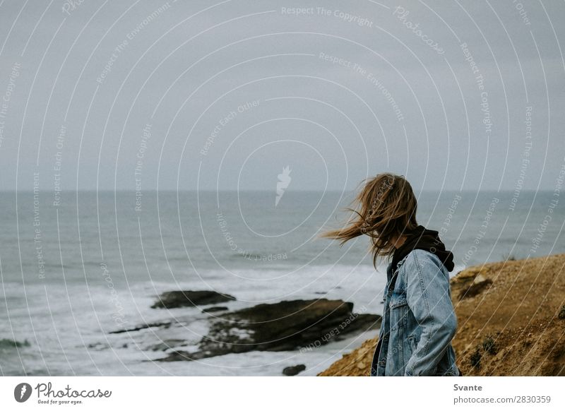 Young man with long hair standing on windy cliff Lifestyle Style Vacation & Travel Trip Adventure Freedom Ocean Waves Human being Youth (Young adults) 1