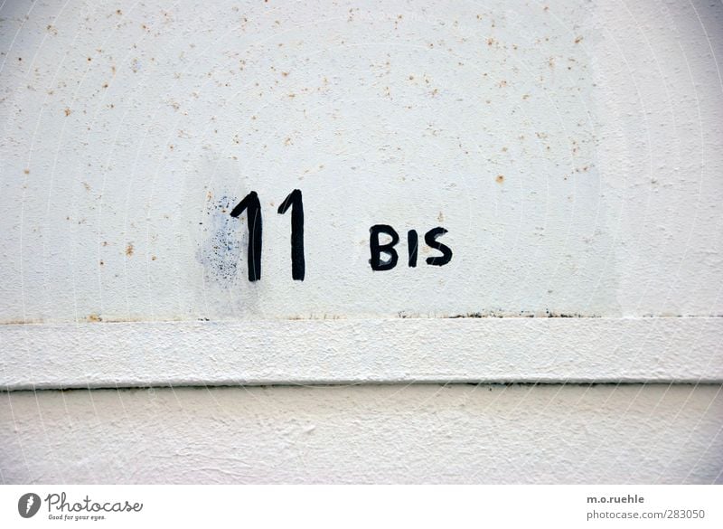 open end Wall (barrier) Wall (building) Facade Sign Characters Digits and numbers Esthetic Numbers 11 Colour photo Exterior shot Pattern Structures and shapes