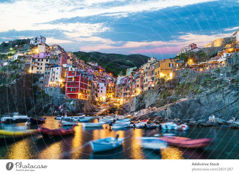 Boats in small town bay Watercraft Bay Town Evening Ocean Vacation & Travel Tourism Harbour Blue Landscape Sky Building City Skyline Port Coast Mountain