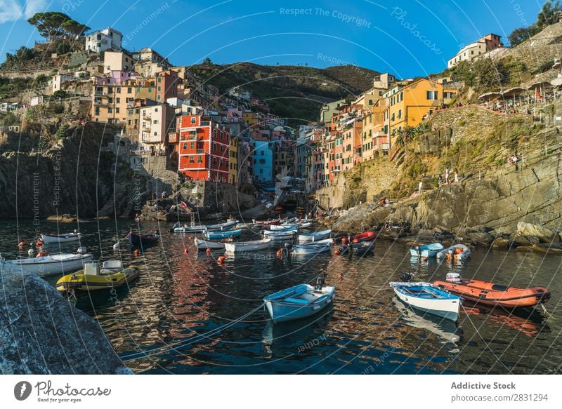 Boats in lagoon on cityscape Skyline Rock Bay coastal Nature Cliff Architecture Watercraft Tourism Coast Destination Landmark Landscape seascape Town