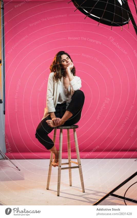 Woman on stool in studio pretty Portrait photograph Youth (Young adults) Sit Stool eyes closed Beautiful Adults Posture Smiling Beauty Photography Attractive