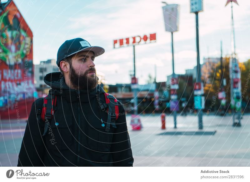 Handsome man looking away on street Man handsome City Street Backpack Looking away Youth (Young adults) Town Lifestyle Easygoing Fashion Style Adults Modern