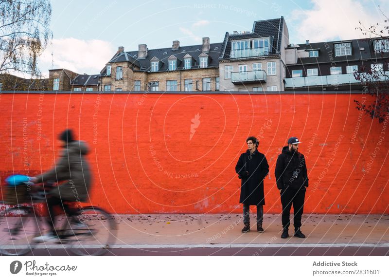 Two men at orange wall Man Stand Orange Wall (building) Together Street handsome City Youth (Young adults) Town Lifestyle Easygoing Fashion Style Adults Modern