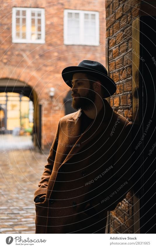 Stylish man leaning on wall Man handsome City Coat Hat Lean Street Youth (Young adults) Town Lifestyle Easygoing Fashion Style Adults Modern Human being