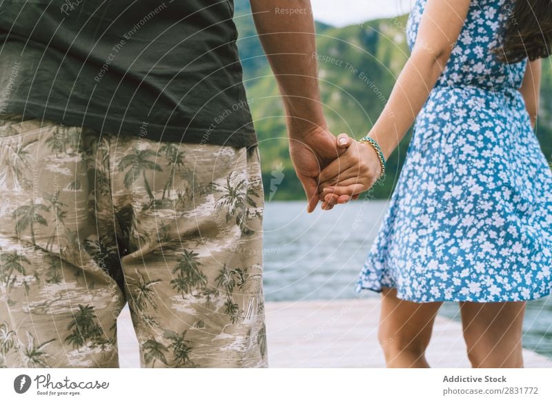 Crop couple posing on pier Couple Jetty Joy Lake Mountain Happy Love Together Nature Summer Water Youth (Young adults) Woman Vacation & Travel Lifestyle