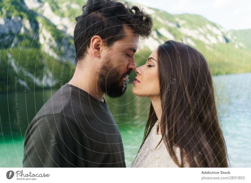 Couple kissing at lake Lake Human being Nature eyes closed Kissing Vacation & Travel Love Summer Happy 2 Man Woman romantic Lifestyle Water Romance Beautiful