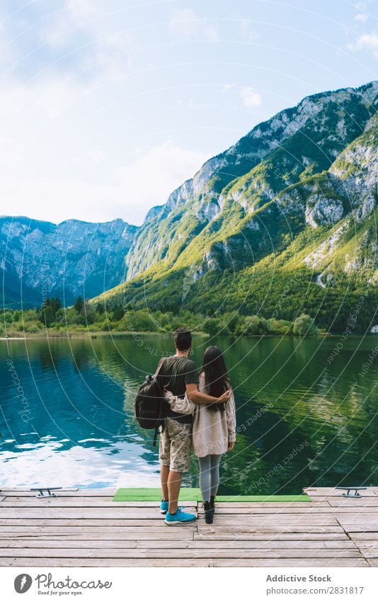 Couple embracing on pier Lake Human being Nature Vacation & Travel Jetty Love Summer Happy 2 Man Woman romantic Lifestyle Water Romance Beautiful