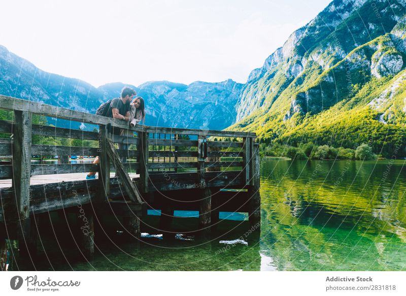 Couple standing on pier Lake Human being Nature Vacation & Travel Jetty Stand Together Love Summer Happy 2 Man Woman romantic Lifestyle Water Romance Beautiful