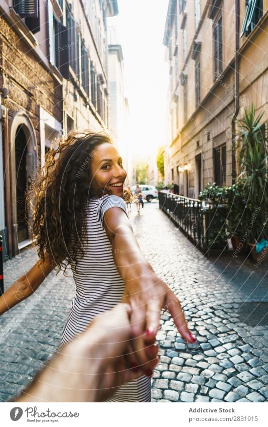 Cheerful traveler posing at street Woman Street Happiness romantic Summer Town spinning round waving hair Beautiful Posture in motion To enjoy Model Feminine