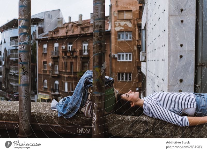 Young pensive woman on bridge fence Human being Fence daydreaming Town Youth (Young adults) Street Summer Considerate Beauty Photography Recklessness