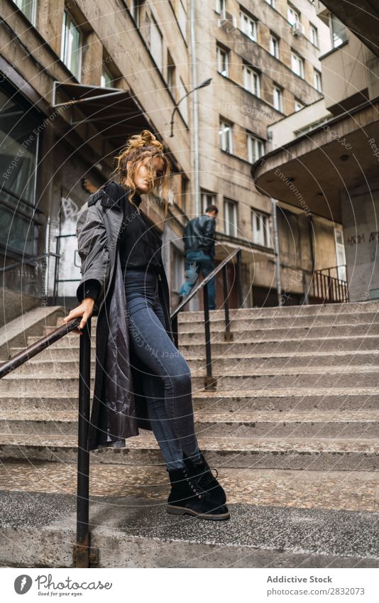 Trendy girl posing on stairs Woman Style Posture Grunge Street Town Stairs Self-confident covering face Relaxation Beauty Photography Hip & trendy City Model