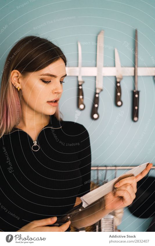 Young woman with kitchen knife Woman pretty Home Youth (Young adults) To enjoy Knives Kitchen Attractive Posture Portrait photograph Beautiful Lifestyle