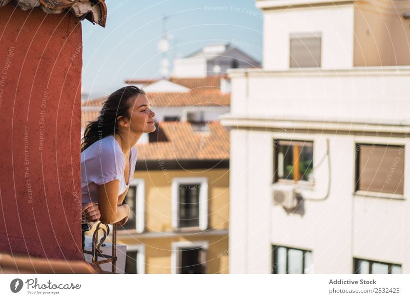 Romantic woman enjoying day on balcony Woman Balcony Morning enjoyment romantic Dream Leisure and hobbies Street Freedom Happiness Summer Skyline Town Terrace