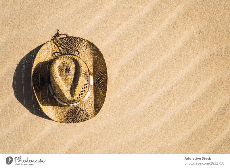 Straw hat on sand Sand Hat Cowboy Coast Vacation & Travel Beach enjoyment Compose Nature Headwear Resort Summer Leisure and hobbies Sunlight Dry Freedom