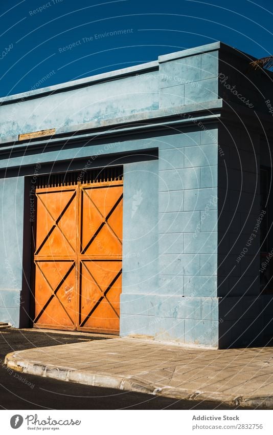 Orange gates in blue wall Exterior Gate Metal Building Consistency Wall (building) Multicoloured Entrance Colour House (Residential Structure) Bright Day