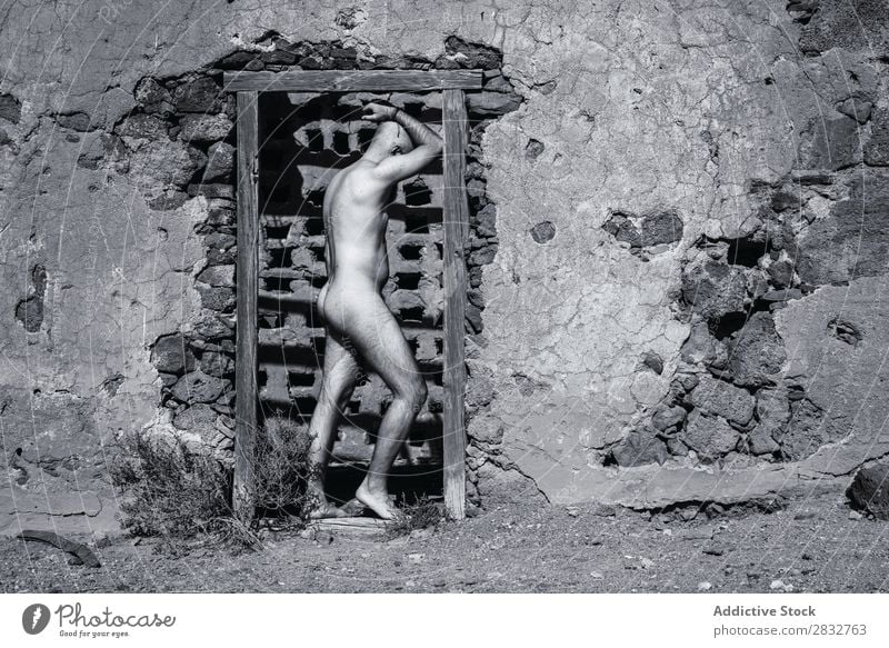 Nude man in doorway of ruined house Man Naked Body Ruin House (Residential Structure) Desert Black & white photo Sun Stand Masculine pose desolated Natural Skin