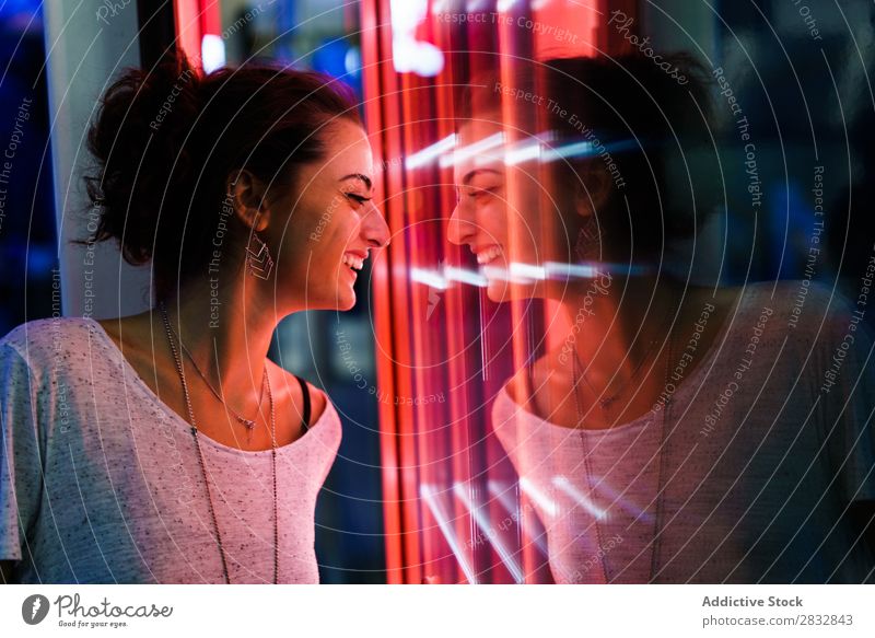 Girl posing near glowing window Woman Window Reflection To enjoy Posture Remote Illumination Expression Loneliness Light Red Style Illuminate Considerate