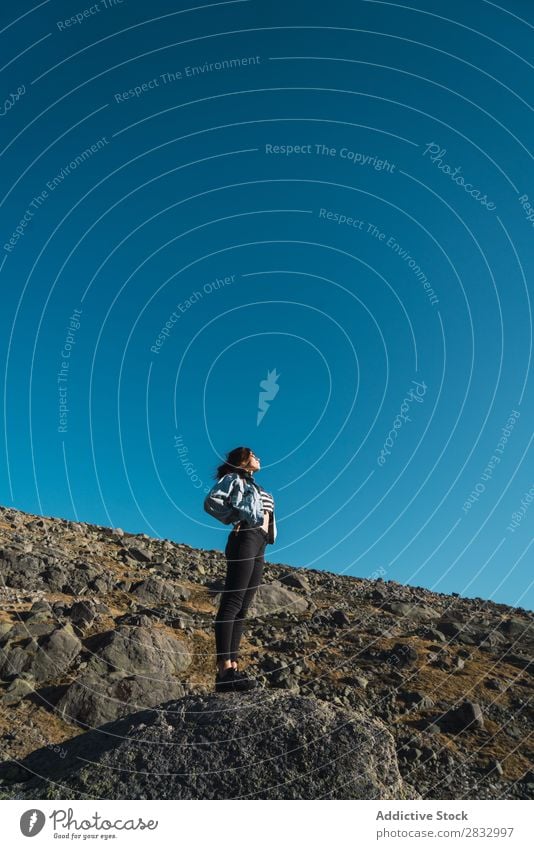 Woman standing on a rocky slope Hill Posture Attractive Beautiful pretty Gorgeous Lovely Human being Youth (Young adults) Freedom Summer Nature Vantage point