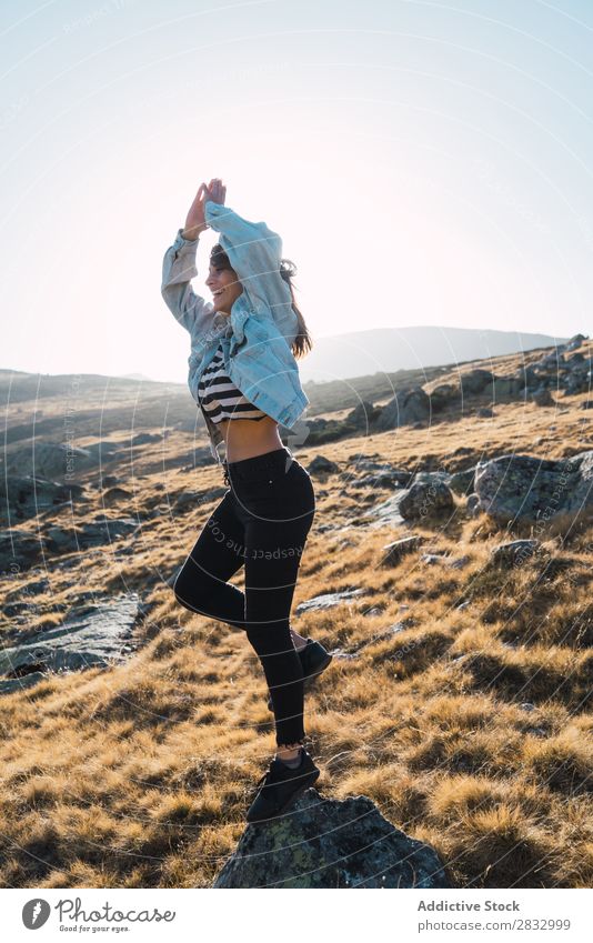 Woman standing on a rocky slope Hill Posture Attractive Beautiful pretty Gorgeous Lovely Human being Youth (Young adults) Freedom Summer Nature Vantage point