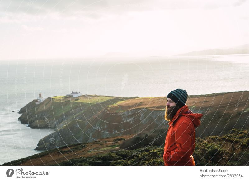 Man posing in mountains Tourist traveler Coast seaside Vacation & Travel Tourism Trip Rock Ocean Landscape Beach Nature Water Natural seascape Stone Beautiful