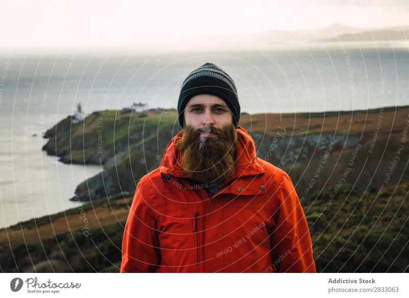 Man posing in mountains Tourist traveler Coast seaside Navigation Vacation & Travel Tourism Trip Rock Ocean Landscape Beach Nature Water Natural seascape Stone