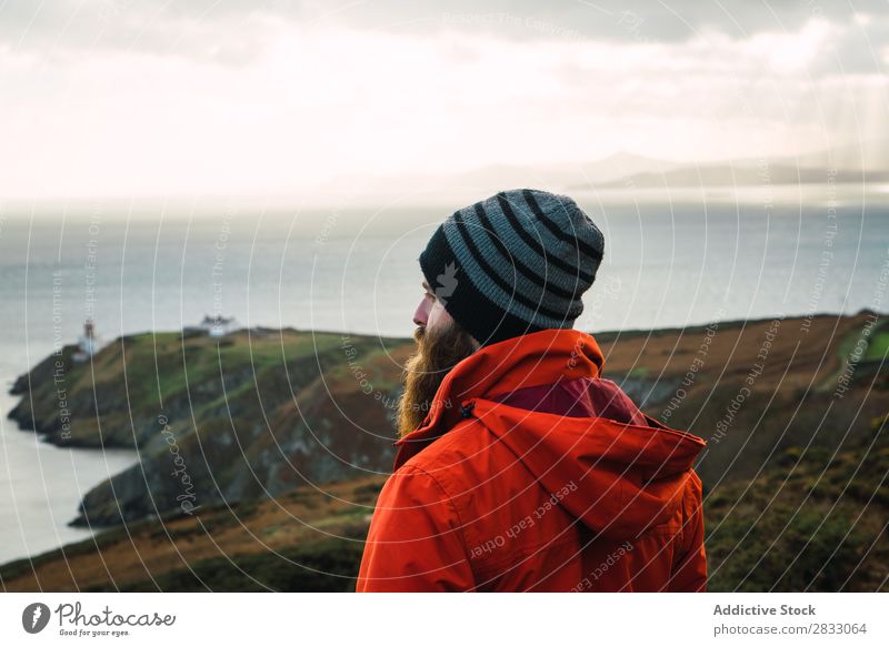 Man posing in mountains Tourist traveler Coast seaside Navigation Vacation & Travel Tourism Trip Rock Ocean Landscape Beach Nature Water Natural seascape Stone