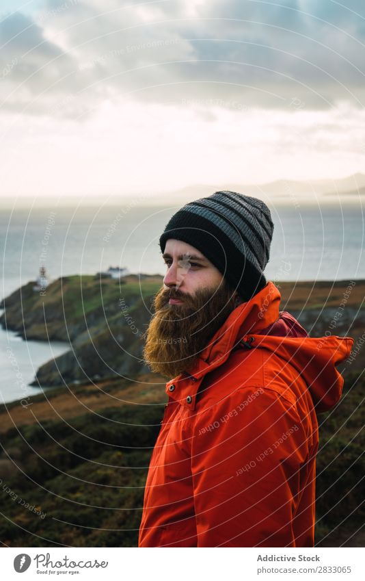 Man posing in mountains Tourist traveler Coast seaside Navigation Vacation & Travel Tourism Trip Rock Ocean Landscape Beach Nature Water Natural seascape Stone