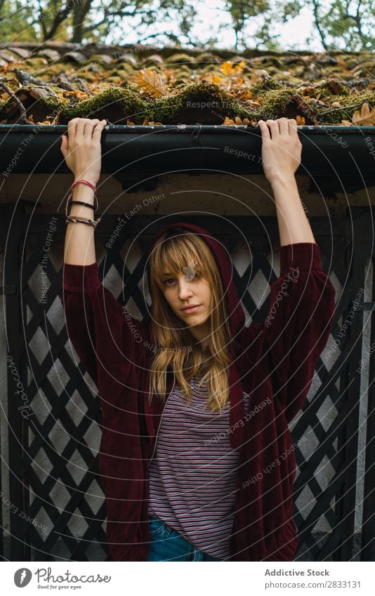 Casual pensive model in fall park Woman Garden Easygoing Leaf romantic Calm daydreaming Autumnal mood Pensive Style Posture Railing Park Natural Relaxation