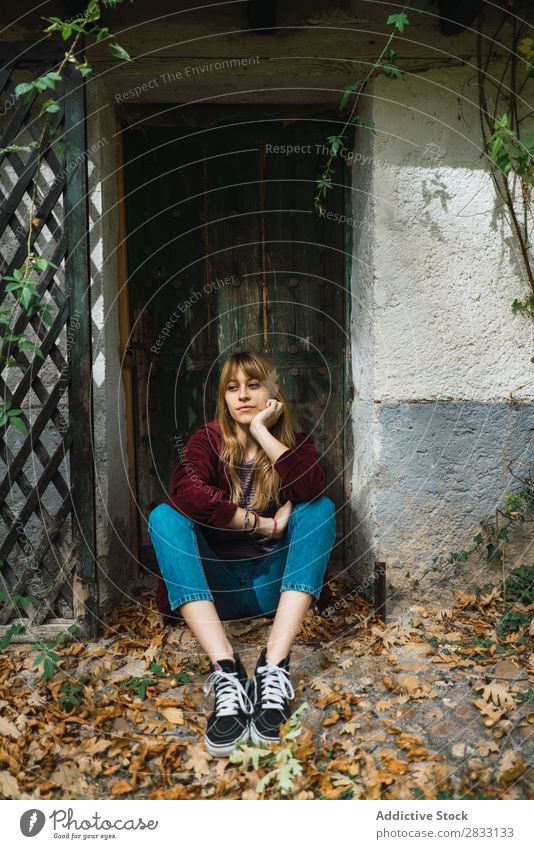 Casual pensive model in fall park Woman Garden Easygoing Leaf romantic Calm daydreaming Autumnal mood Pensive Style Posture Railing Park Natural Relaxation