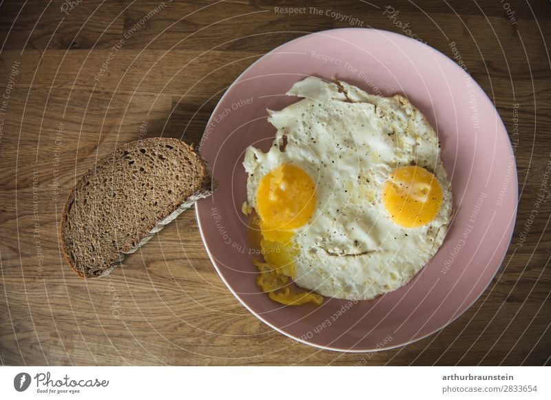 Fried egg face with slice of bread Food Bread Egg Fried egg sunny-side up Slice of bread Nutrition Breakfast Crockery Plate Healthy Healthy Eating Cook Mirror