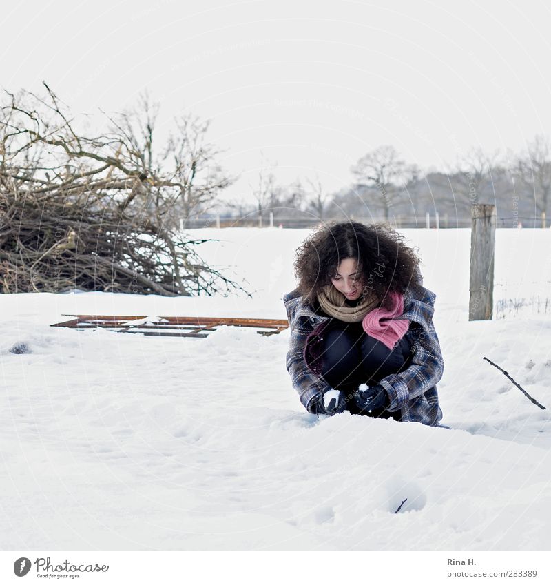 The first snow 1 Human being Nature Landscape Winter Snow Field Coat Scarf Gloves Hair and hairstyles Brunette Long-haired Curl Crouch Playing Authentic