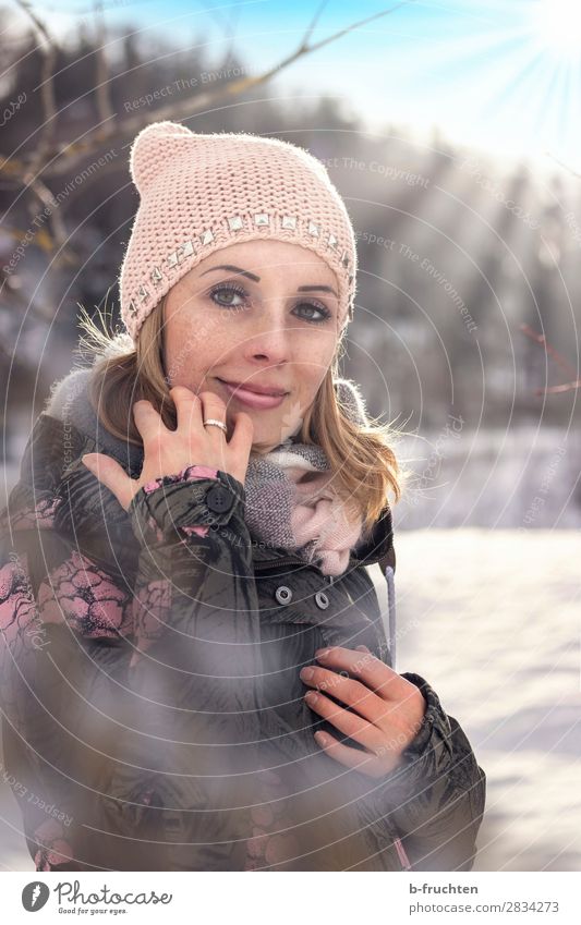 Woman with cap and scarf, outdoor portrait in winter Well-being Leisure and hobbies Adults Face 30 - 45 years Sunlight Winter Beautiful weather Snow Park Forest