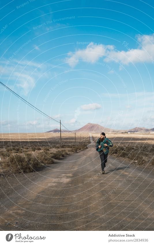 Man walking on road in field Tourist Field Walking Mountain Dry Clouds Nature Landscape Natural Rock Stone Lanzarote Spain Vantage point Vacation & Travel