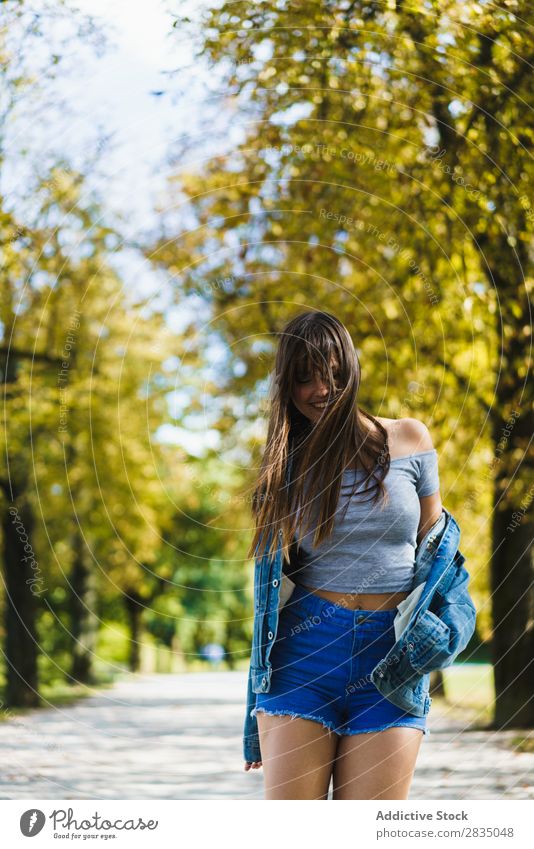 Cheerful woman walking in park Woman Park Autumn Walking Smiling pretty Nature Girl Lifestyle Seasons Yellow Leisure and hobbies Tree Youth (Young adults) Happy