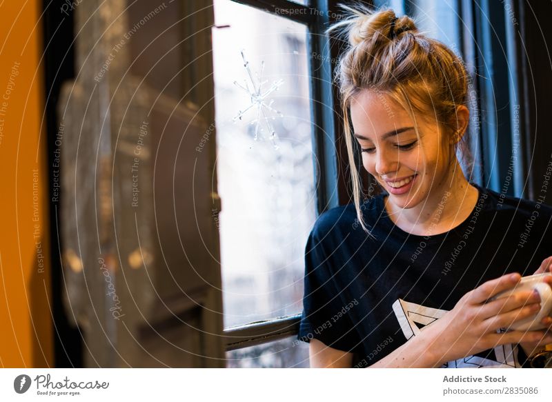 Smiling woman holding cup near window Cup Youth (Young adults) Woman Beautiful Beauty Photography Portrait photograph Human being Copy Space Caucasian