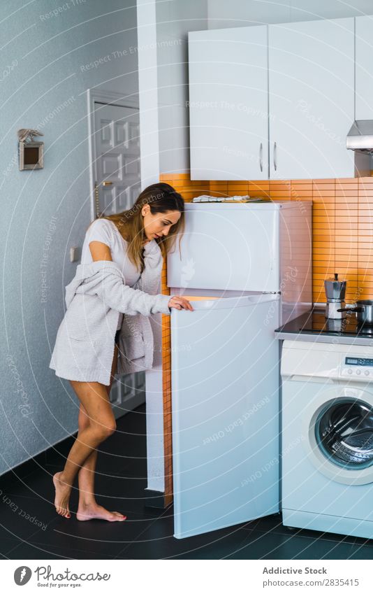 Pretty woman at opened fridge Woman pretty Home Youth (Young adults) Take refrigerator Opening Posture Portrait photograph Beautiful Lifestyle