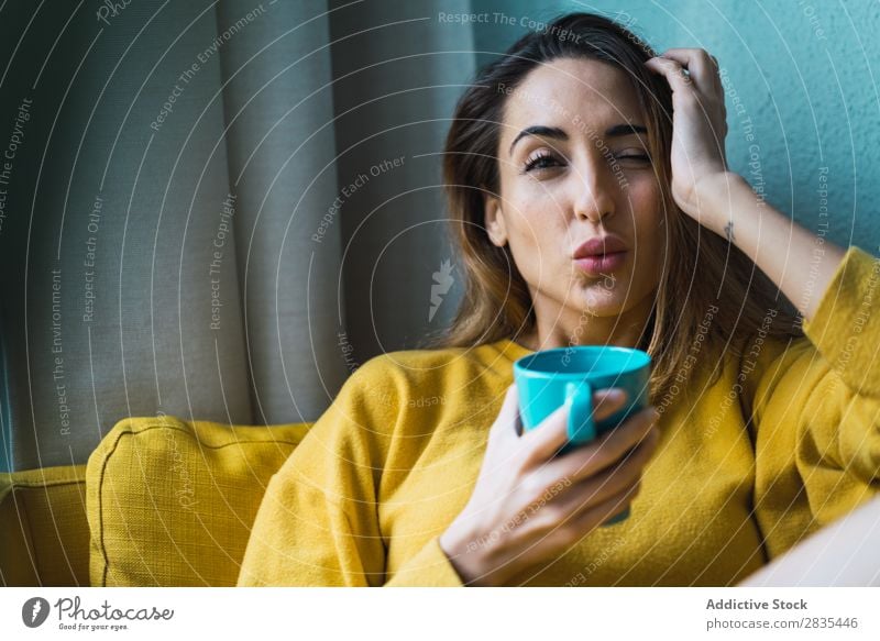 Dreamy woman with cup Woman pretty Home Youth (Young adults) Posture Pensive holding head Cup Hot Drinking Relaxation Considerate Portrait photograph Beautiful