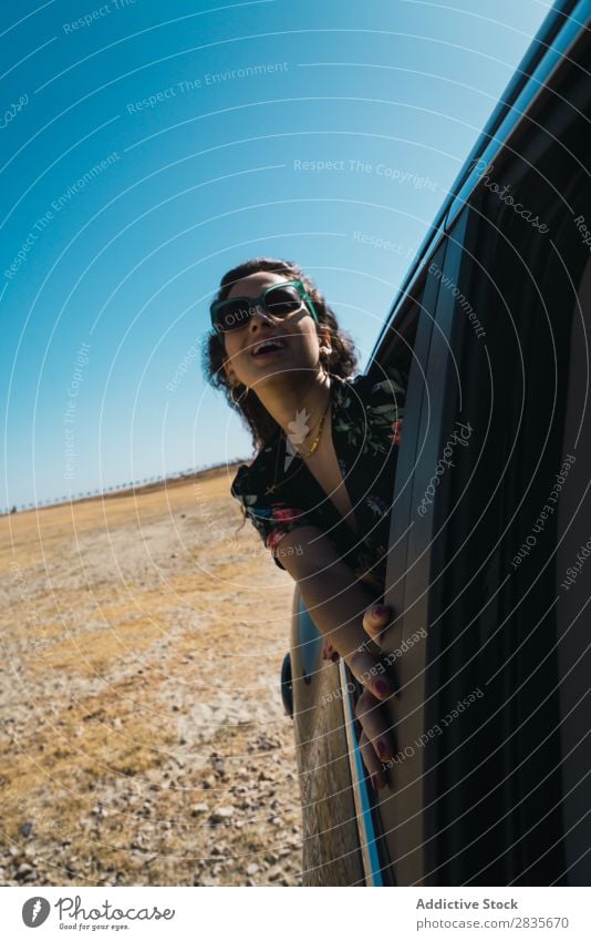 Woman enjoying riding car in desert Car Freedom Wind Window Speed Beauty Photography Vehicle waving hair Transport Joy Environment Vacation & Travel Summer