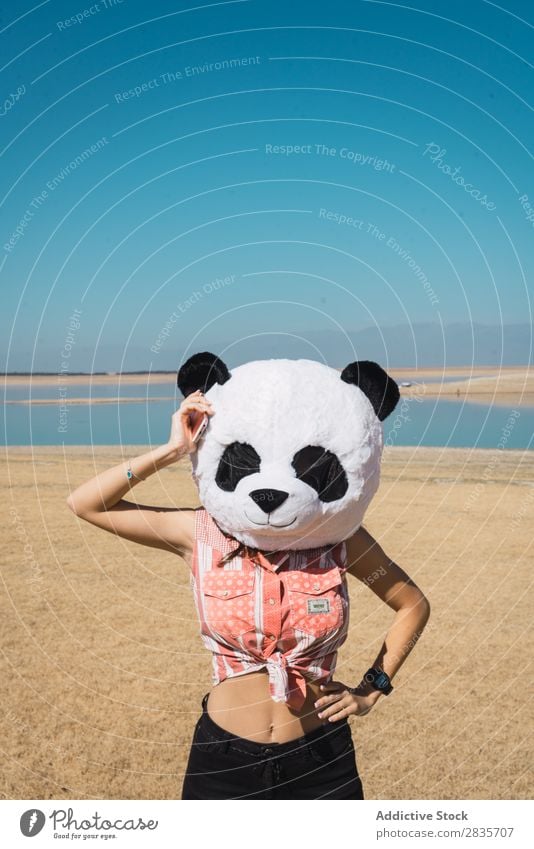 Woman wearing panda hat on nature Hat Creativity Panda Costume Traveling Nature Wear having fun Landscape Relaxation Wanderlust Artificial Style pose