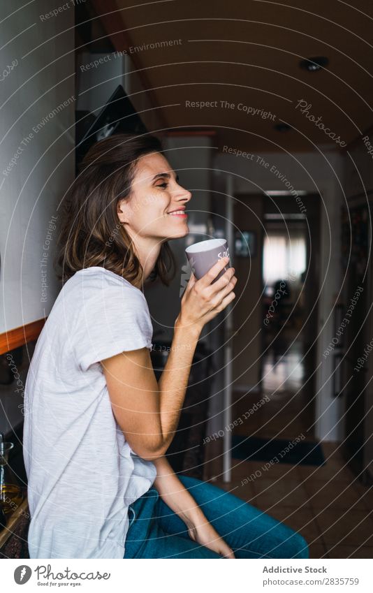 Girl sitting at the kitchen bar drinking coffee Woman Kitchen Smiling Home Happy Youth (Young adults) Cheerful pretty Attractive Beautiful Portrait photograph