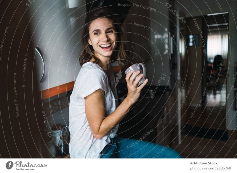 Girl sitting at the kitchen bar drinking coffee Woman Kitchen Smiling Home Happy Youth (Young adults) Cheerful pretty Attractive Beautiful Portrait photograph