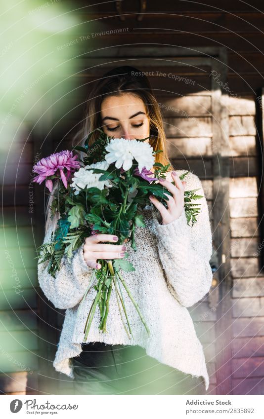 Romantic woman with flowers on porch Woman Flower smelling Cottage Leisure and hobbies Relaxation Recklessness romantic tenderness Aromatic Fragrant To enjoy