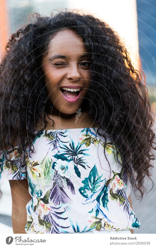 Expressive winking girl Woman pretty Youth (Young adults) Portrait photograph emotional Looking into the camera Black African City Town Street Head Beautiful