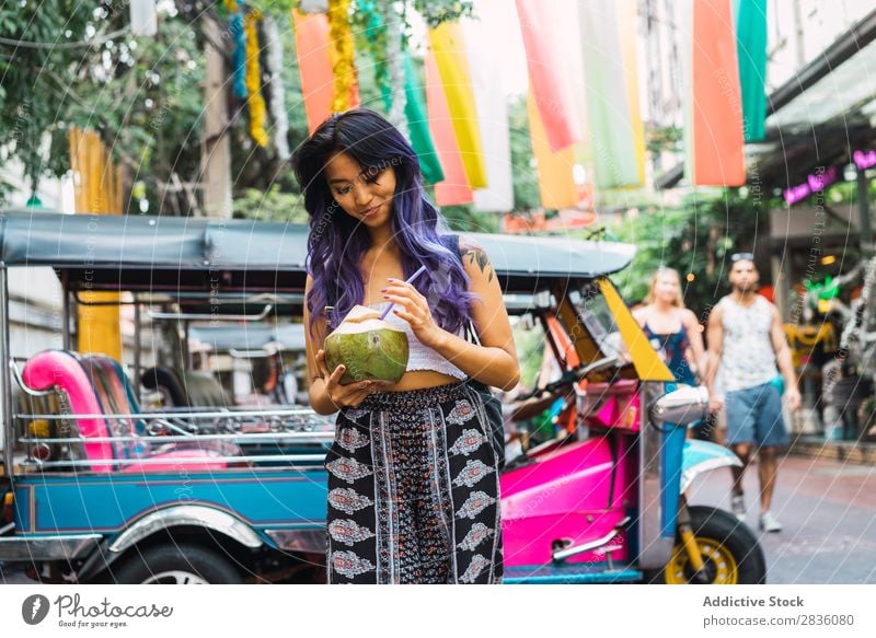 Young woman with coconut drink on street Woman pretty Street Youth (Young adults) Beautiful Portrait photograph Stand Coconut Drinking Straw Hair Purple asian