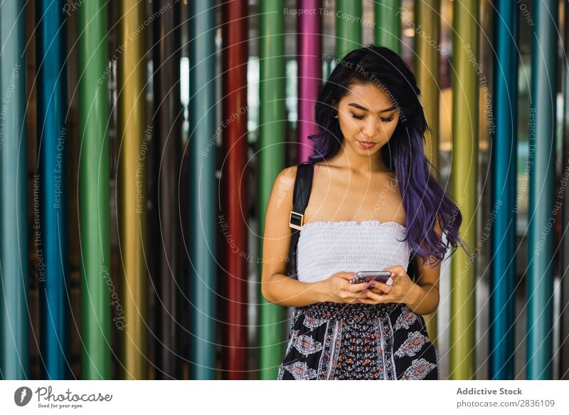 Young woman leaning on colorful columns Woman pretty Street Youth (Young adults) Beautiful Column Lean Multicoloured Portrait photograph Hair Purple asian