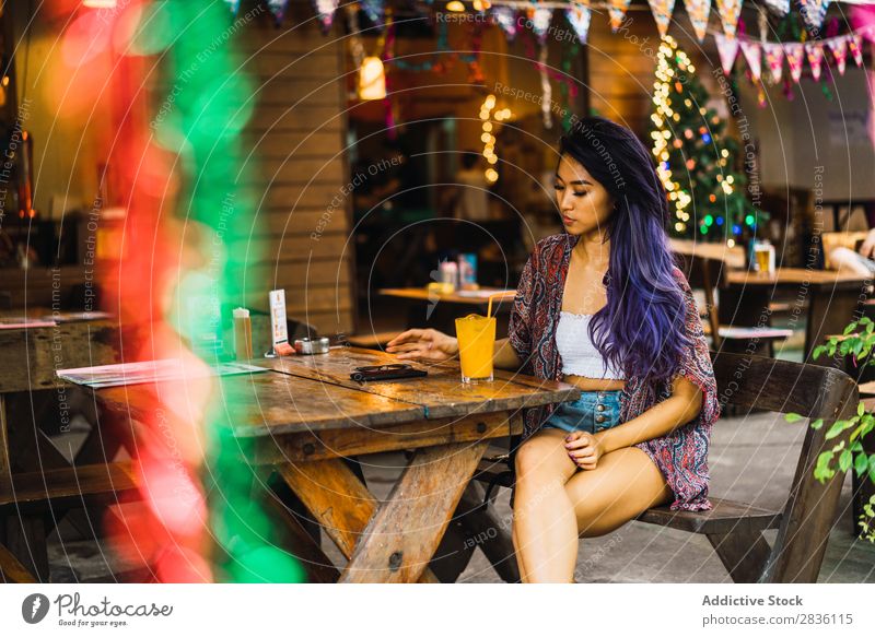 Woman with smartphone in cafe pretty Youth (Young adults) Beautiful Portrait photograph Juice Drinking PDA using browsing Café Hair Purple asian eastern Fashion