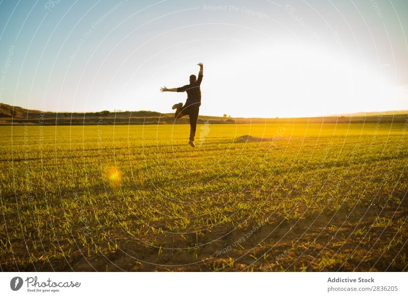 Man jumping on sunny field Field Joy Jump Happiness Summer Freedom Nature Action Human being Youth (Young adults) Meadow Grass Energy Green Lifestyle Running