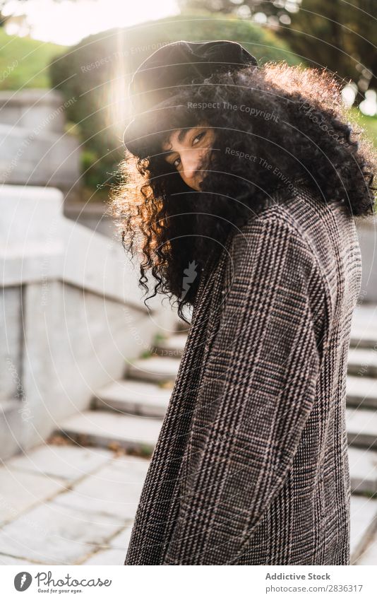 Pretty stylish woman in park Woman Attractive City fashionable Curly Brunette Park Green Coat Hat Fashion Youth (Young adults) Beautiful pretty Street Model