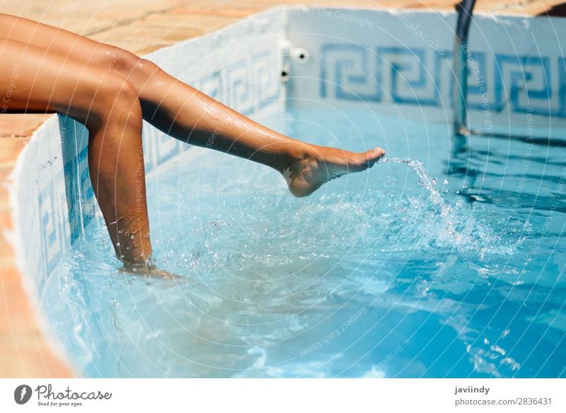 Legs of a woman enjoying water of a swimming pool spa Lifestyle Happy Beautiful Body Skin Relaxation Swimming pool Leisure and hobbies Vacation & Travel Tourism