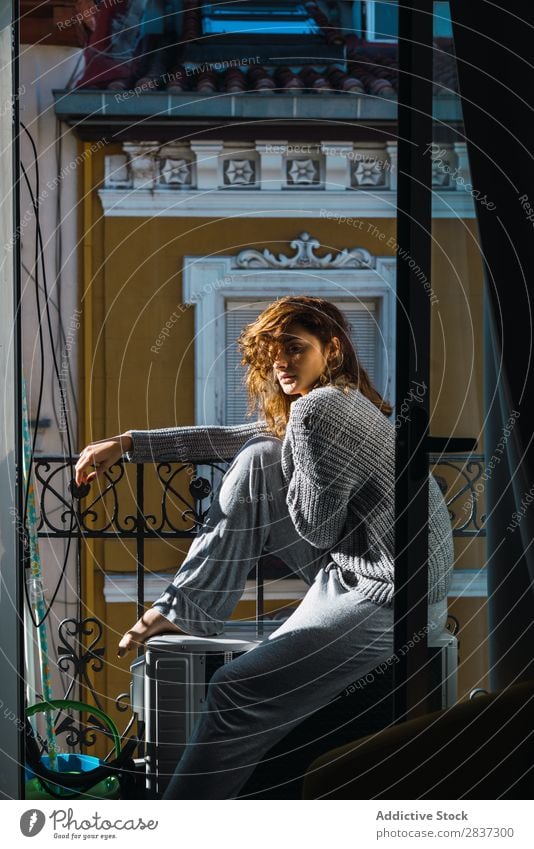 Young woman posing on balcony Woman Home pretty Balcony Relaxation Sit Youth (Young adults) Posture Portrait photograph Beautiful Lifestyle Beauty Photography